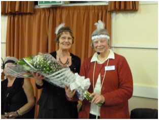 Pam Foakes presenting Sheila Gray with her bouquet